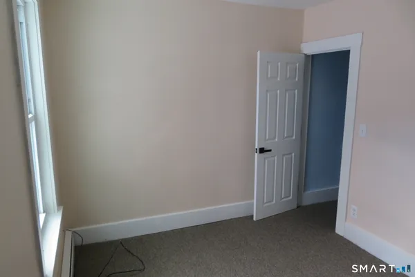 a view of hallway with rug