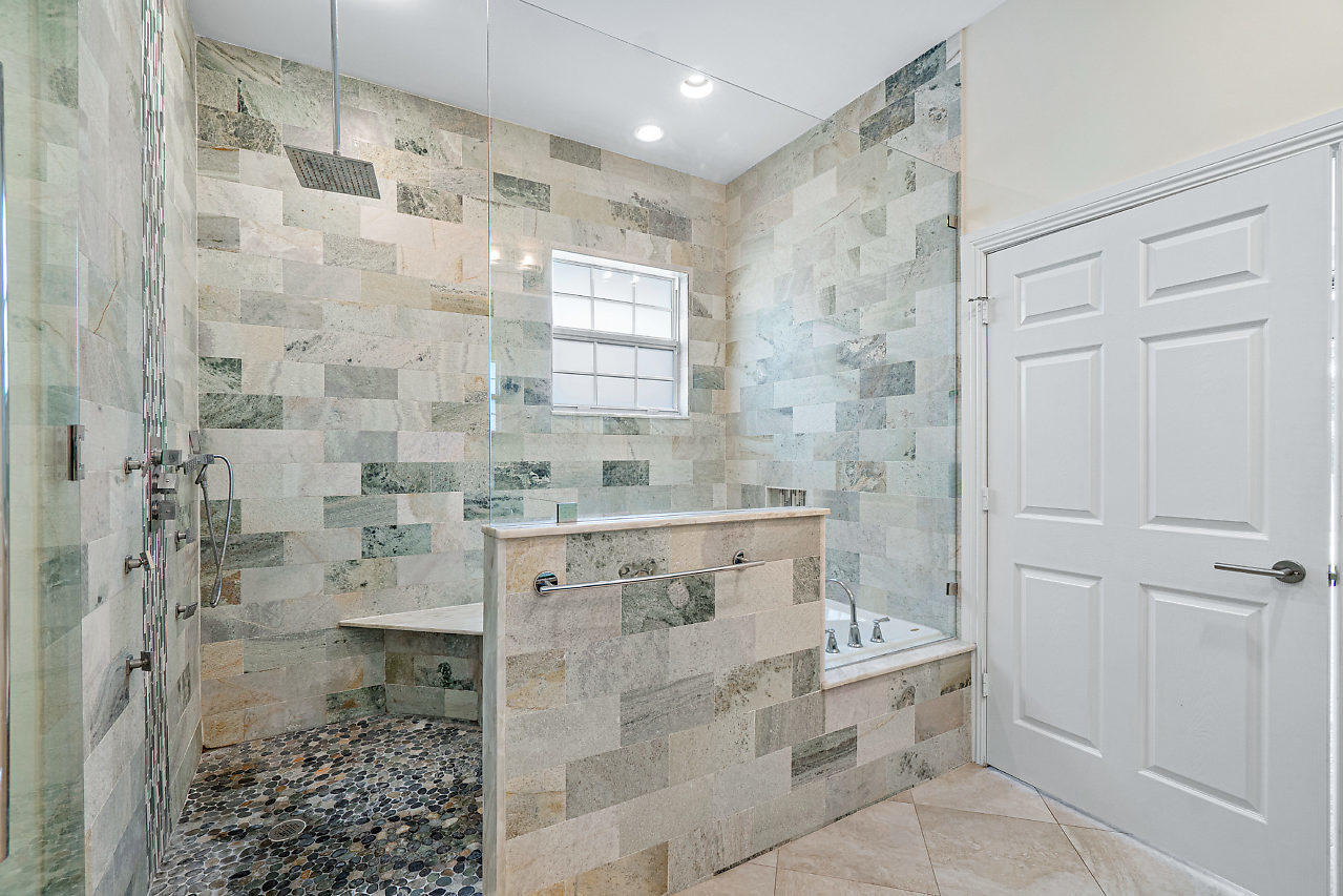 3605 Gulfstream Road Palm Springs, FL 33461 - Photo 16 of 35 a bathroom with a shower and a sink