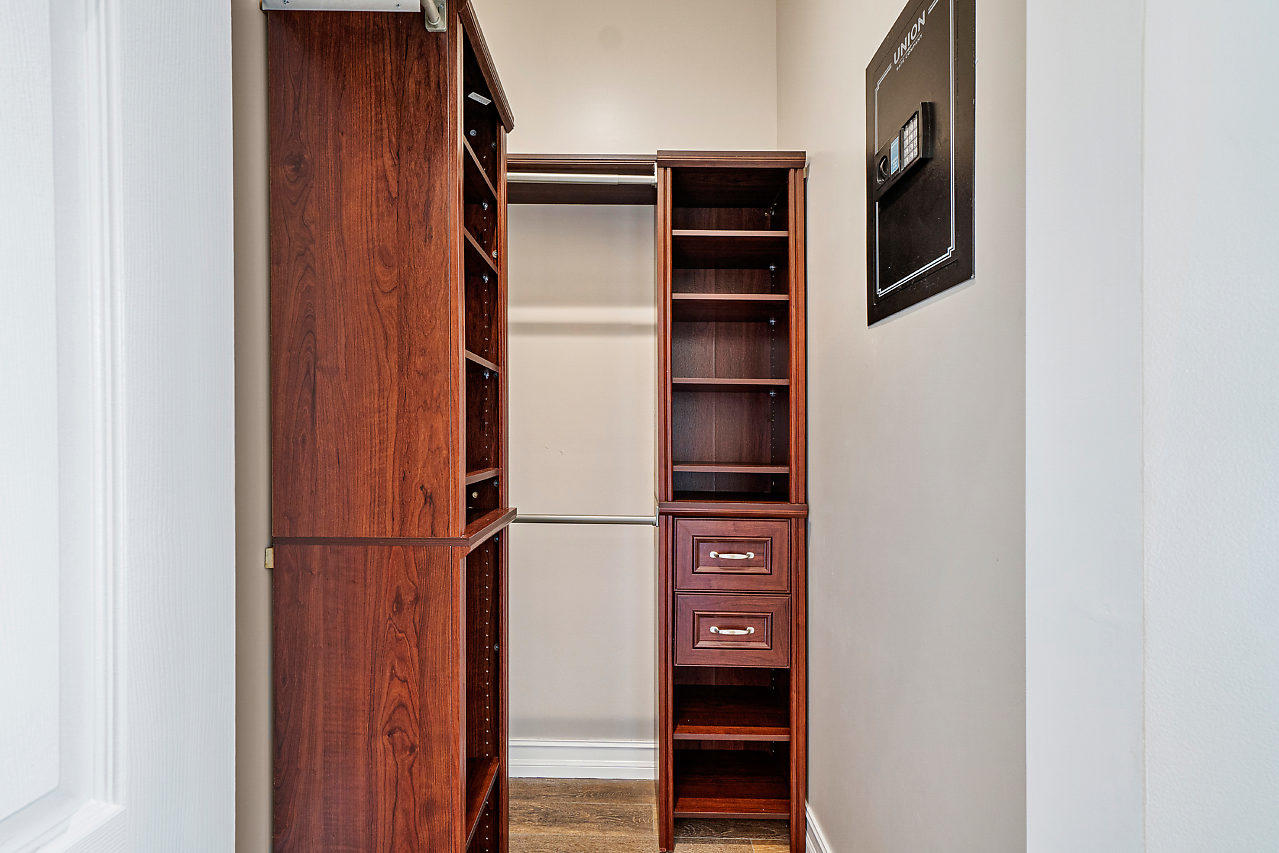 3605 Gulfstream Road Palm Springs, FL 33461 - Photo 17 of 35 a view of walk in closet with clothes and shoes
