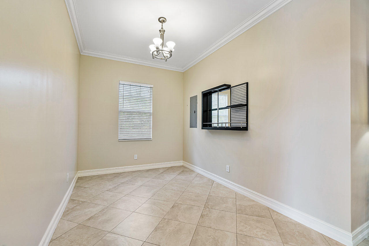 3605 Gulfstream Road Palm Springs, FL 33461 - Photo 25 of 35 a view of entryway with window