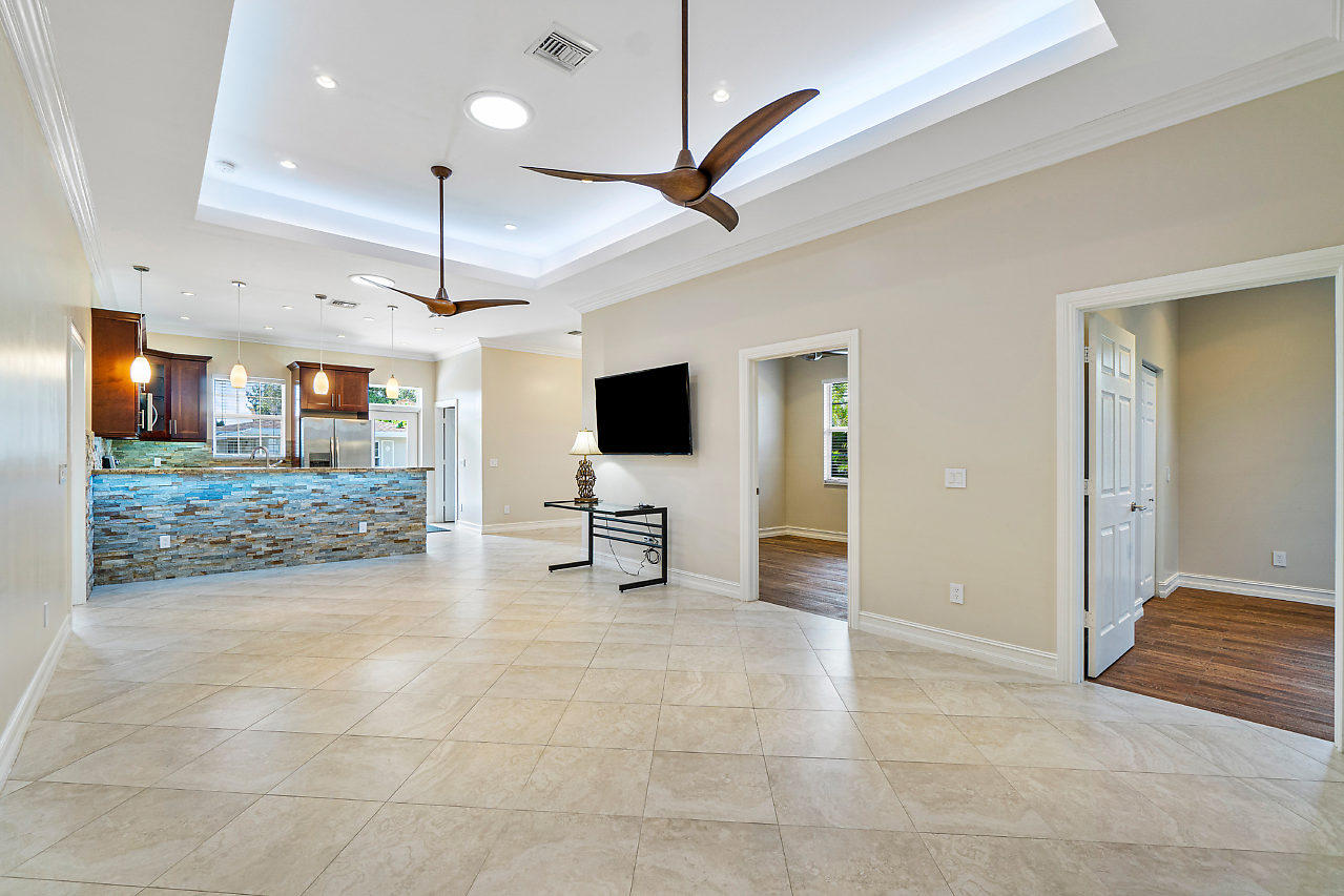 3605 Gulfstream Road Palm Springs, FL 33461 - Photo 3 of 35 a view of a livingroom with furniture and a flat screen tv