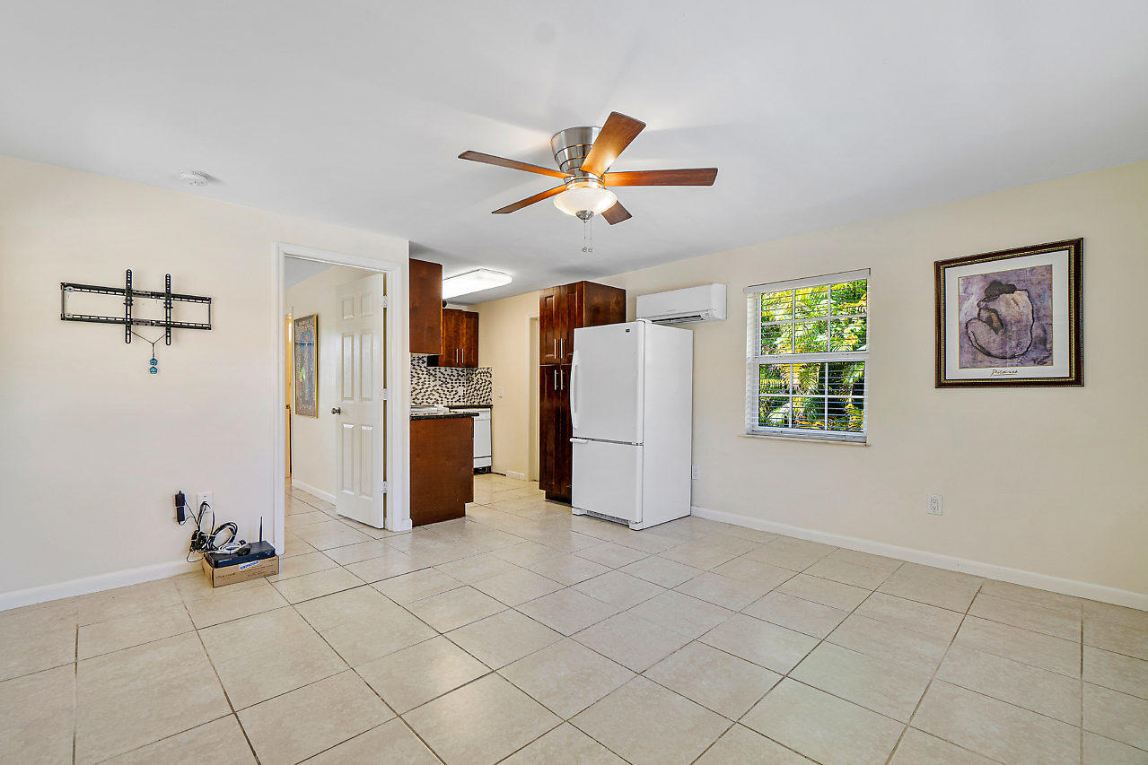 3605 Gulfstream Road Palm Springs, FL 33461 - Photo 31 of 35 a view of a livingroom with furniture and a ceiling fan