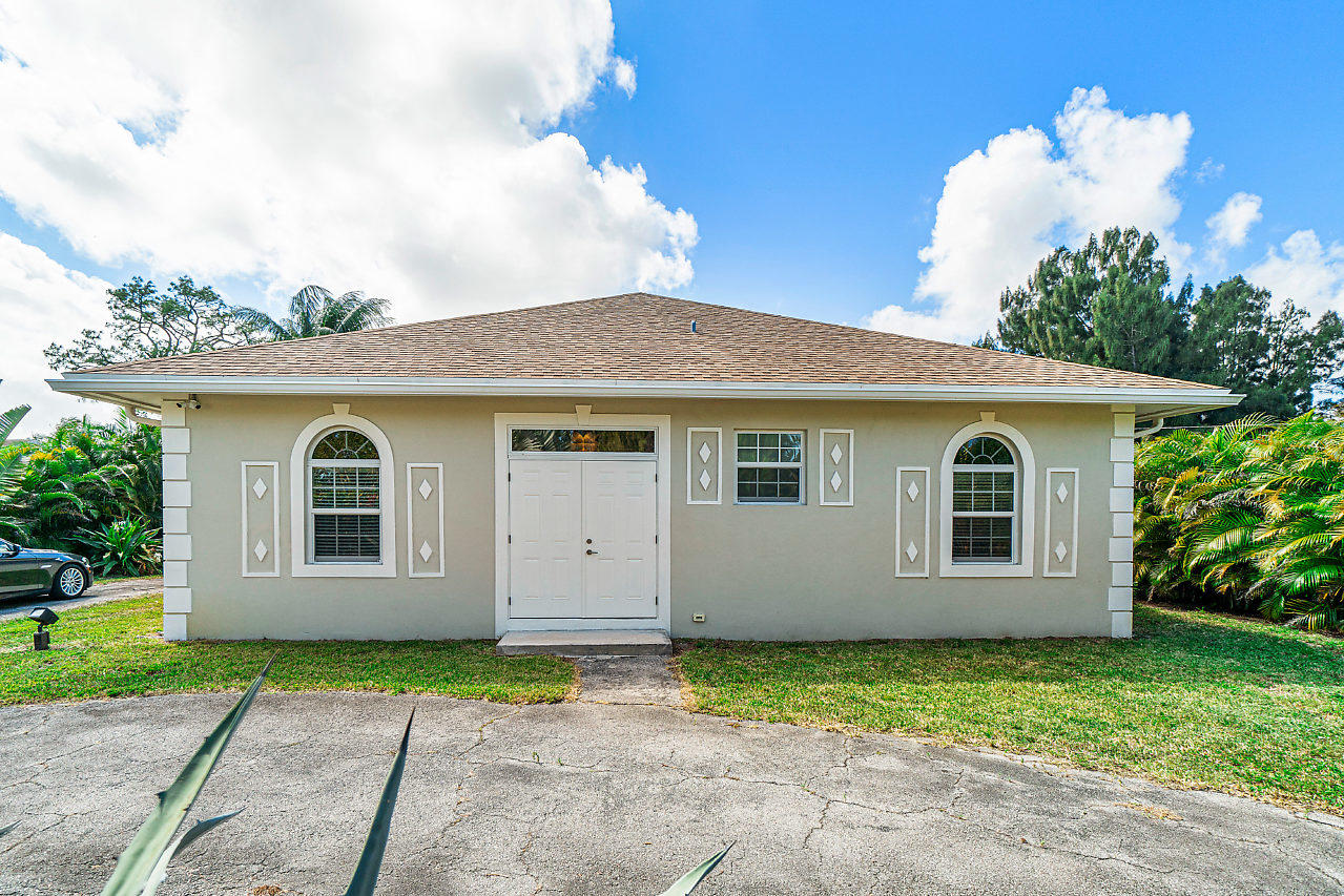 3605 Gulfstream Road Palm Springs, FL 33461 - Photo 10 of 35 a view of a house with a yard