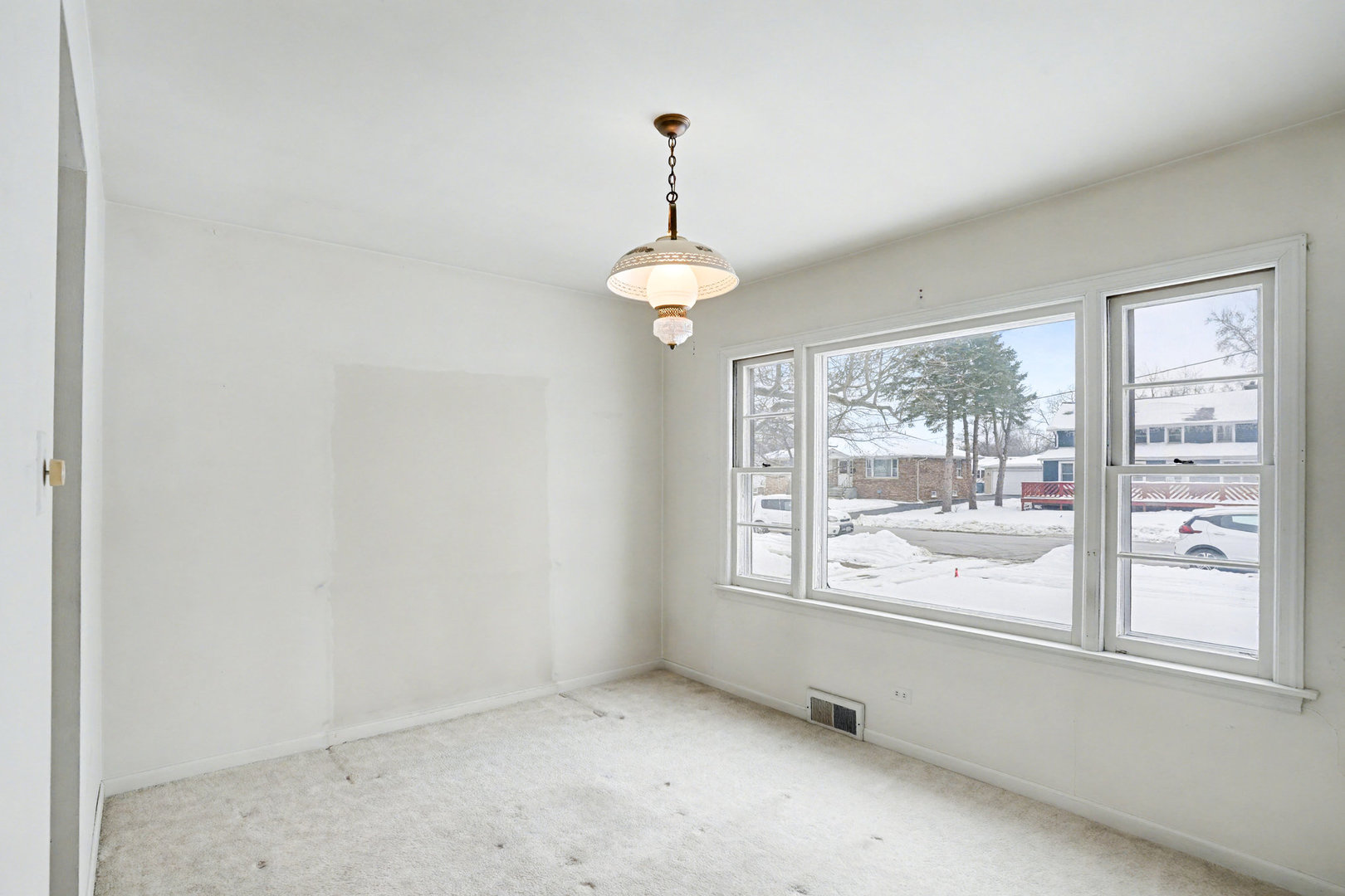 347 Cass Street Crete, IL 60417 - Photo 4 of 13 a view of an empty room with a window