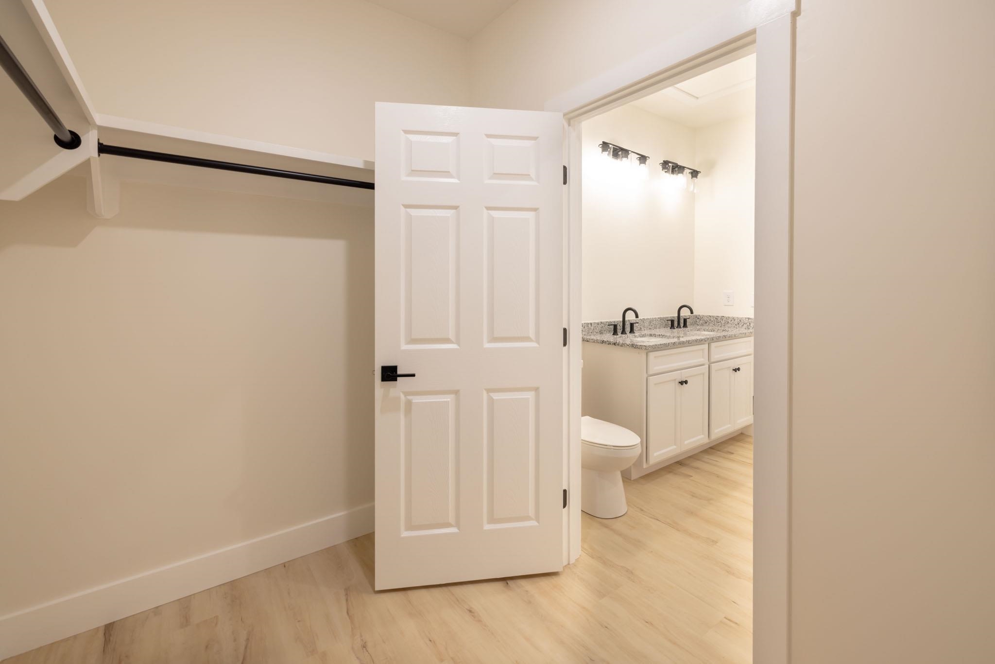37 William Teague Lane Ramer, TN 38367 - Photo 27 of 39 Interior featuring wood-finish flooring and a white six-panel door with matte black hardware