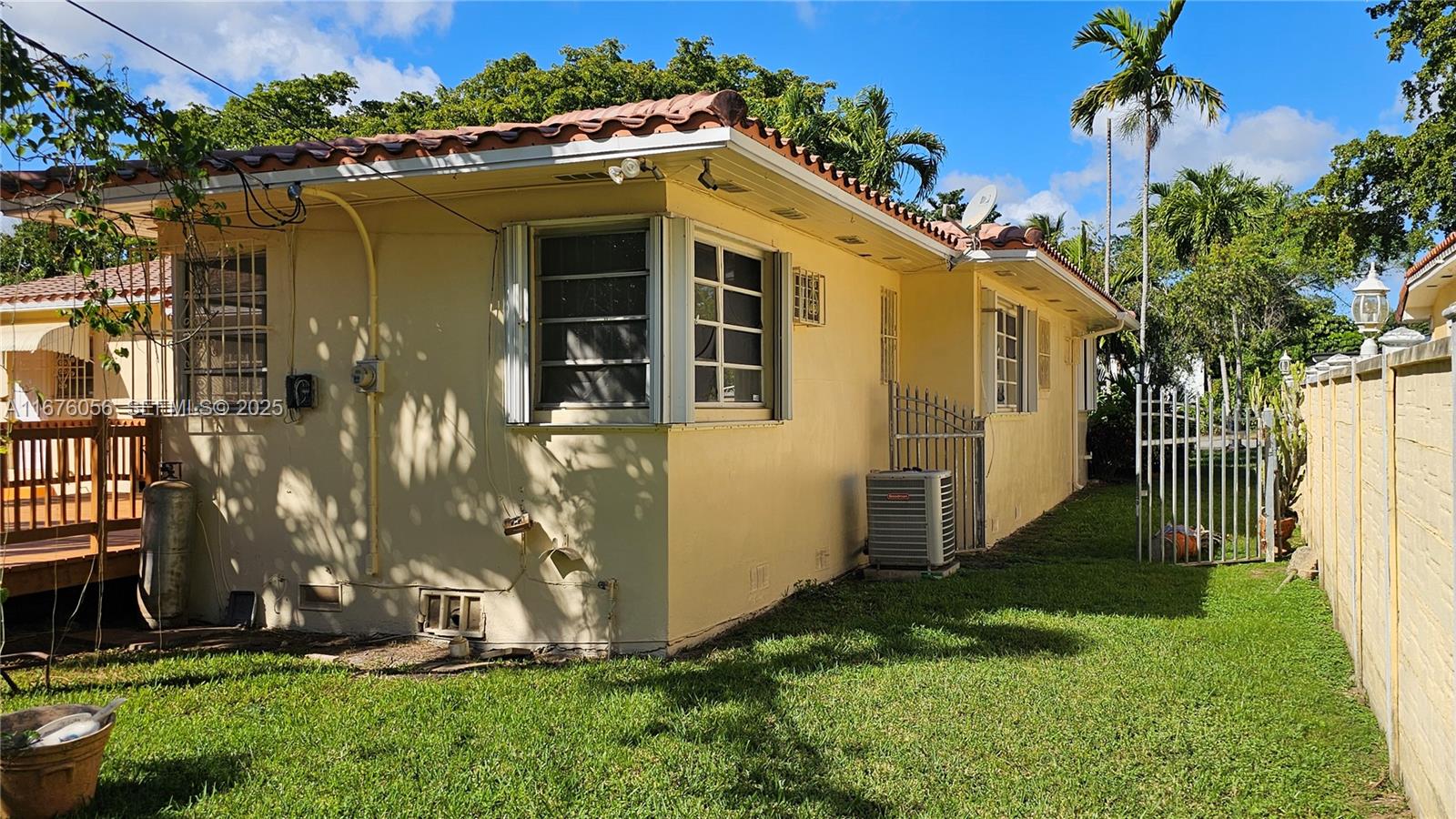 156 Northwest 88th Street El Portal, FL 33150 - Photo 13 of 56 a front view of a house with a yard