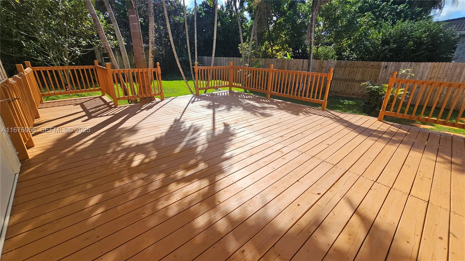 156 Northwest 88th Street El Portal, FL 33150 - Photo 22 of 56 a view of deck with wooden floor and outdoor seating
