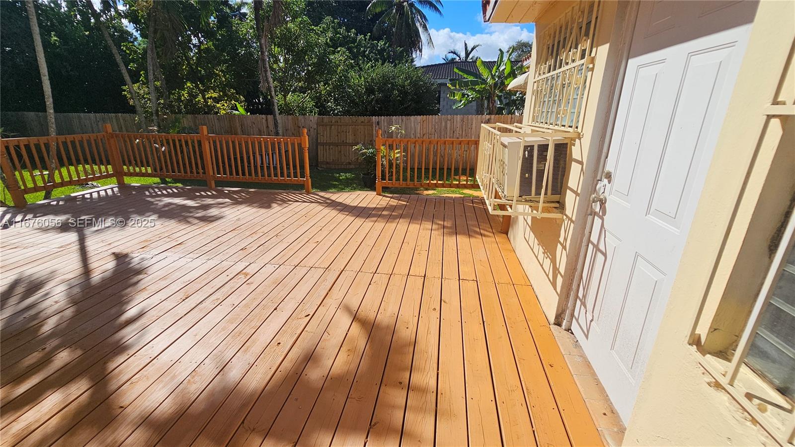 156 Northwest 88th Street El Portal, FL 33150 - Photo 25 of 56 a view of balcony with wooden floor and fence