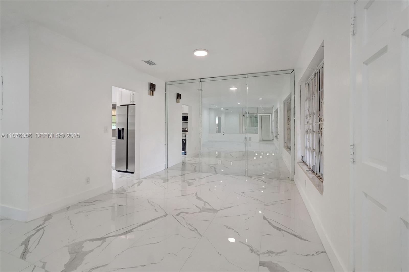 156 Northwest 88th Street El Portal, FL 33150 - Photo 26 of 56 a bathroom with a glass shower door and a shower