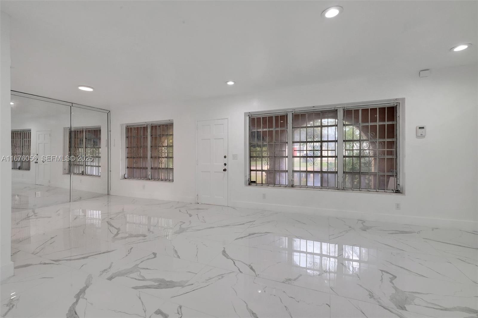 156 Northwest 88th Street El Portal, FL 33150 - Photo 29 of 56 a view of an empty room with a window