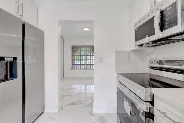 a bathroom with a sink toilet and vanity