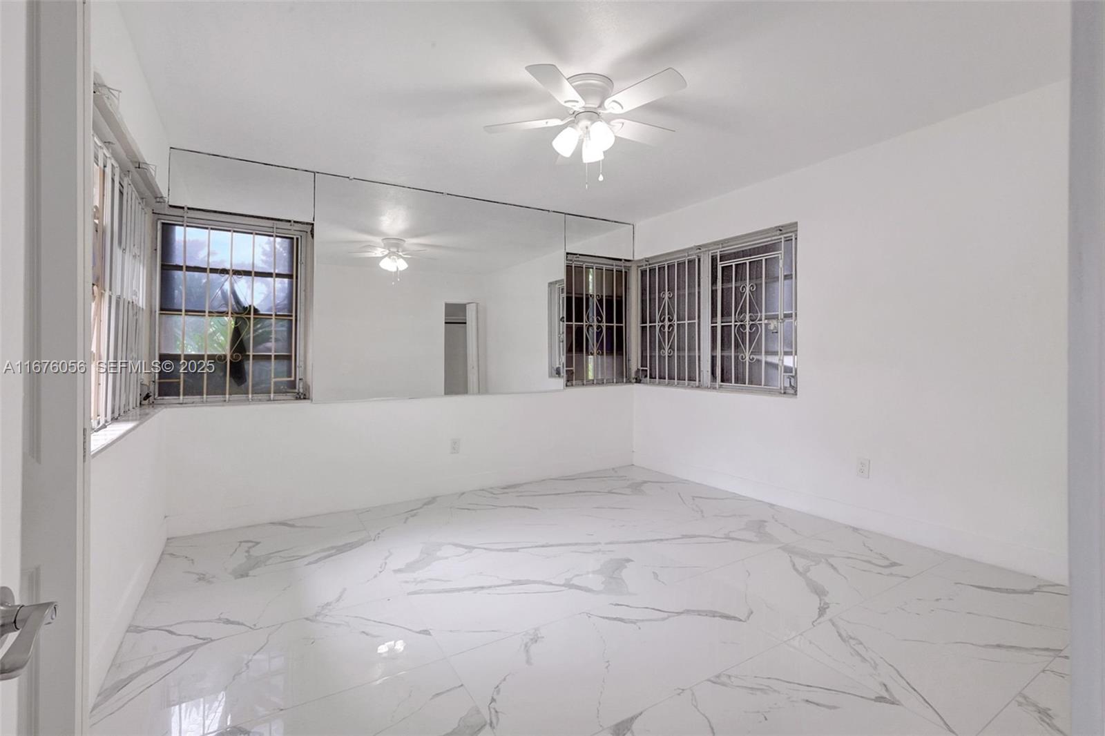 156 Northwest 88th Street El Portal, FL 33150 - Photo 42 of 56 a view of an empty room with a window