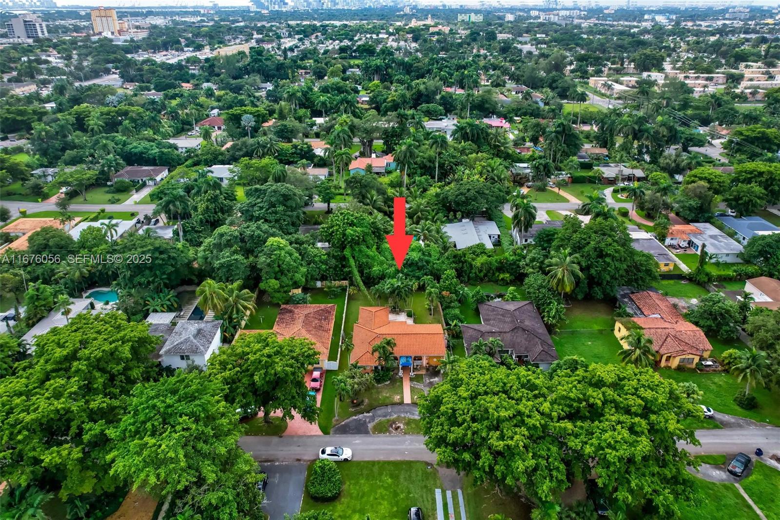 156 Northwest 88th Street El Portal, FL 33150 - Photo 47 of 56 an aerial view of house with yard and swimming pool