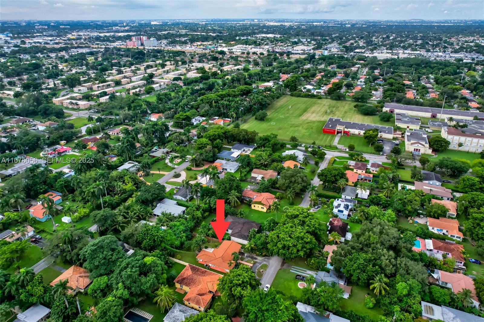 156 Northwest 88th Street El Portal, FL 33150 - Photo 50 of 56 an aerial view of residential houses with outdoor space and trees