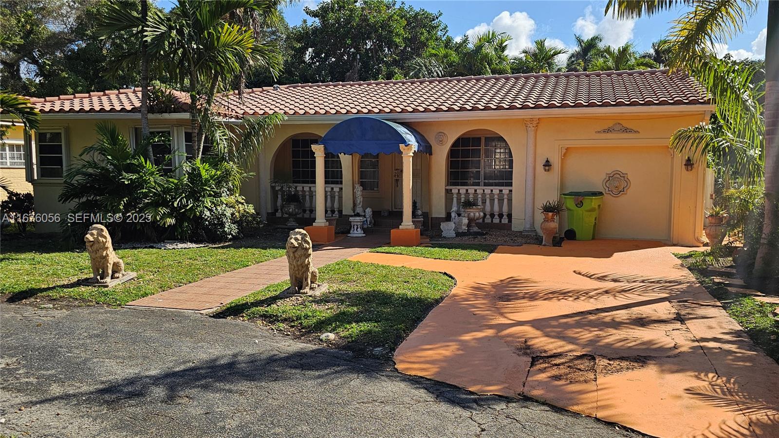 156 Northwest 88th Street El Portal, FL 33150 - Photo 5 of 56 a front view of a house with garden