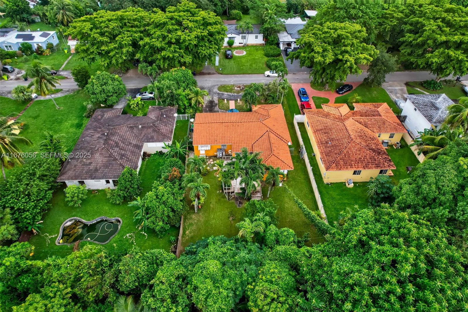 156 Northwest 88th Street El Portal, FL 33150 - Photo 55 of 56 an aerial view of a house with garden space and street view