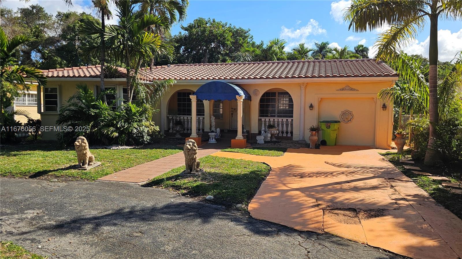 156 Northwest 88th Street El Portal, FL 33150 - Photo 6 of 56 a front view of a house with garden