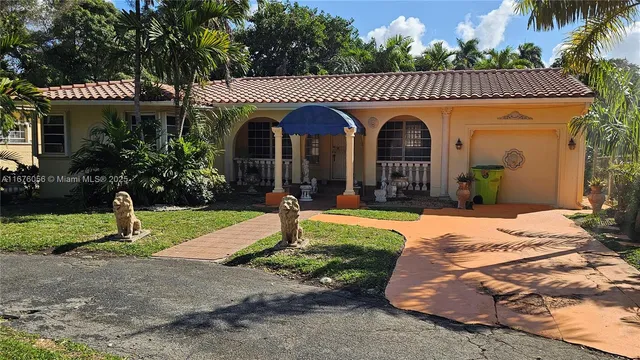 a front view of a house with garden