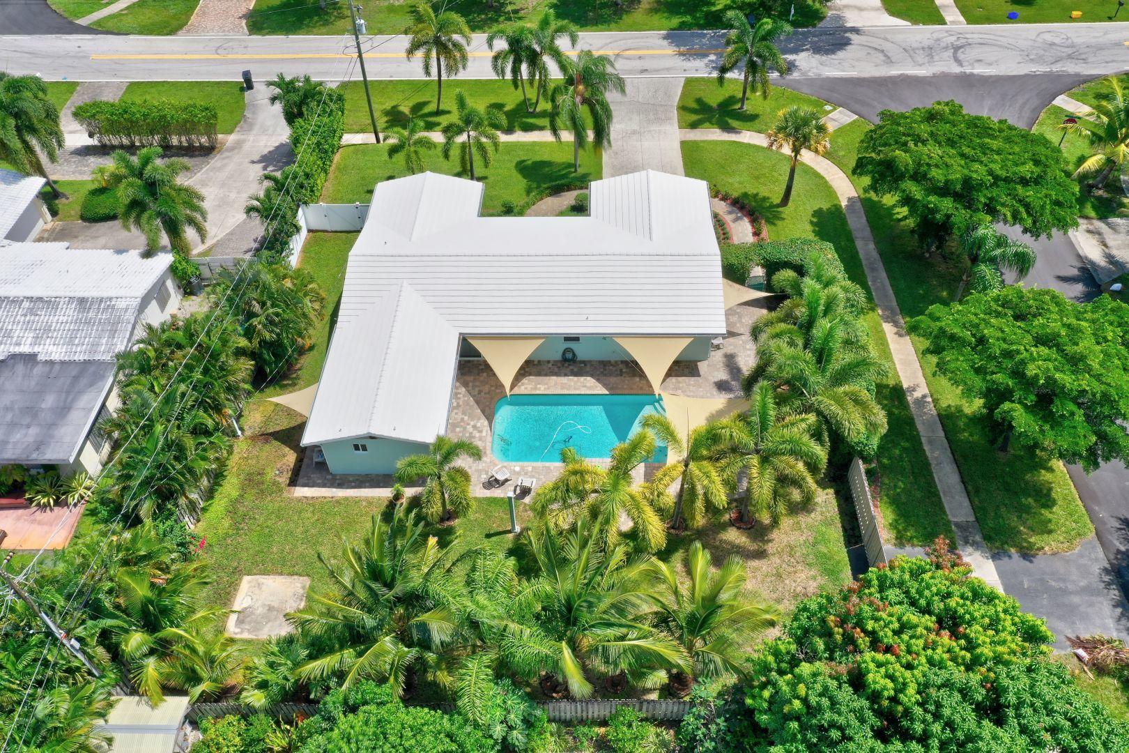 12771 Ellison Wilson Road Juno Beach, FL 33408 - Photo 4 of 7 an aerial view of a house with yard