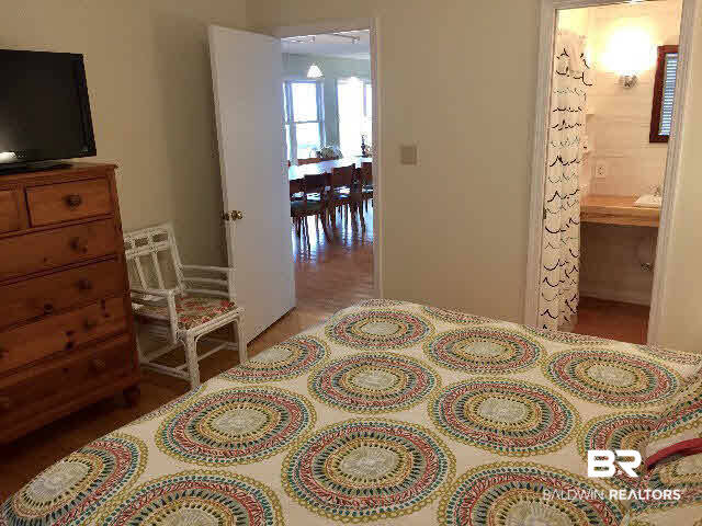 8749 Pompano Way Gulf Shores, AL 36542 - Photo 21 of 45 dining table in back ground