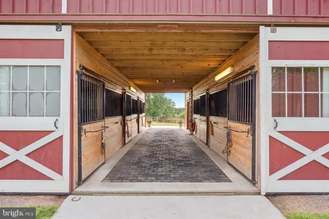 a view of backyard with deck and a garden