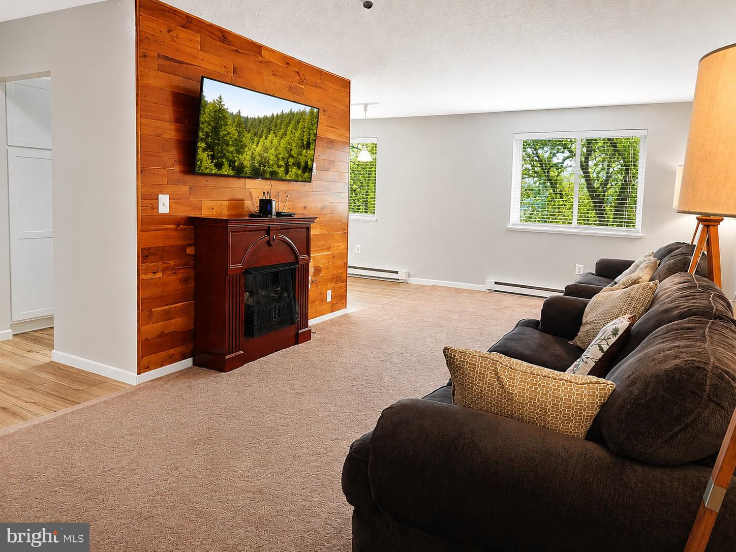 1724 Mosser Road, Unit 11 McHenry, MD 21541 - Photo 2 of 24 a living room with furniture and a flat screen tv