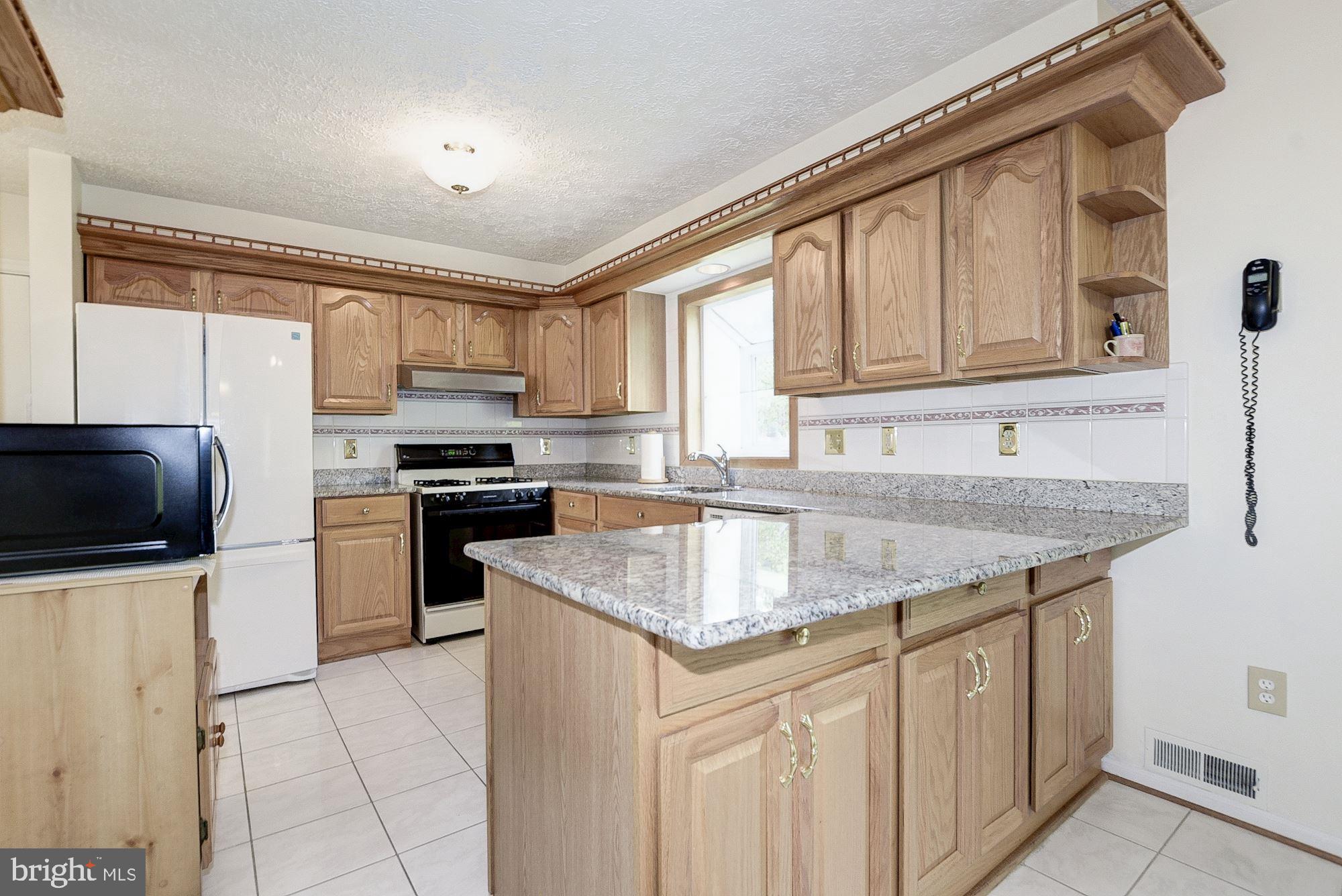 2101 Falling Creek Road Silver Spring, MD 20904 - Photo 24 of 53 Kitchen ceramic tile flooring and Granite