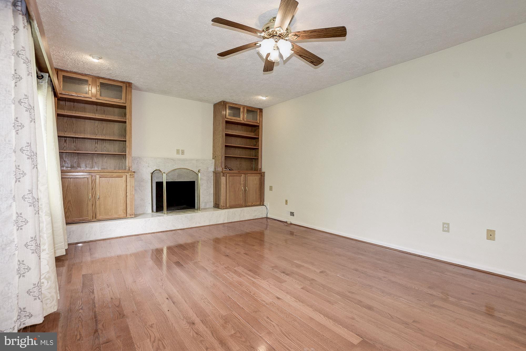 2101 Falling Creek Road Silver Spring, MD 20904 - Photo 27 of 53 Family room with hardwood flooring