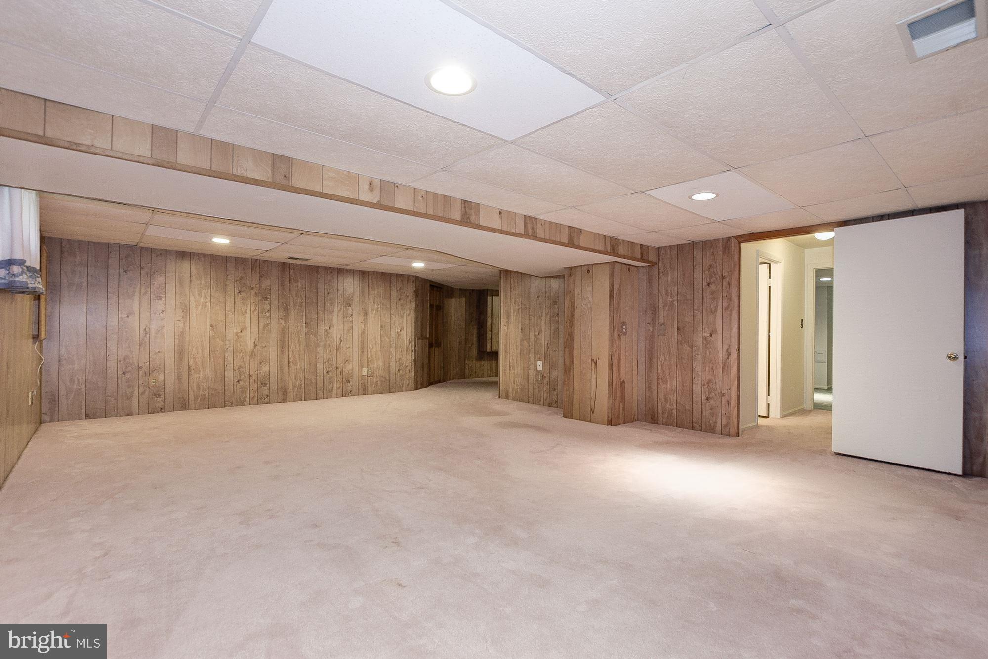 2101 Falling Creek Road Silver Spring, MD 20904 - Photo 45 of 53 Lower level rec room with access to hall to bath