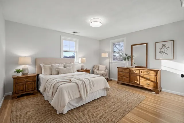 a bedroom with a bed and a dresser