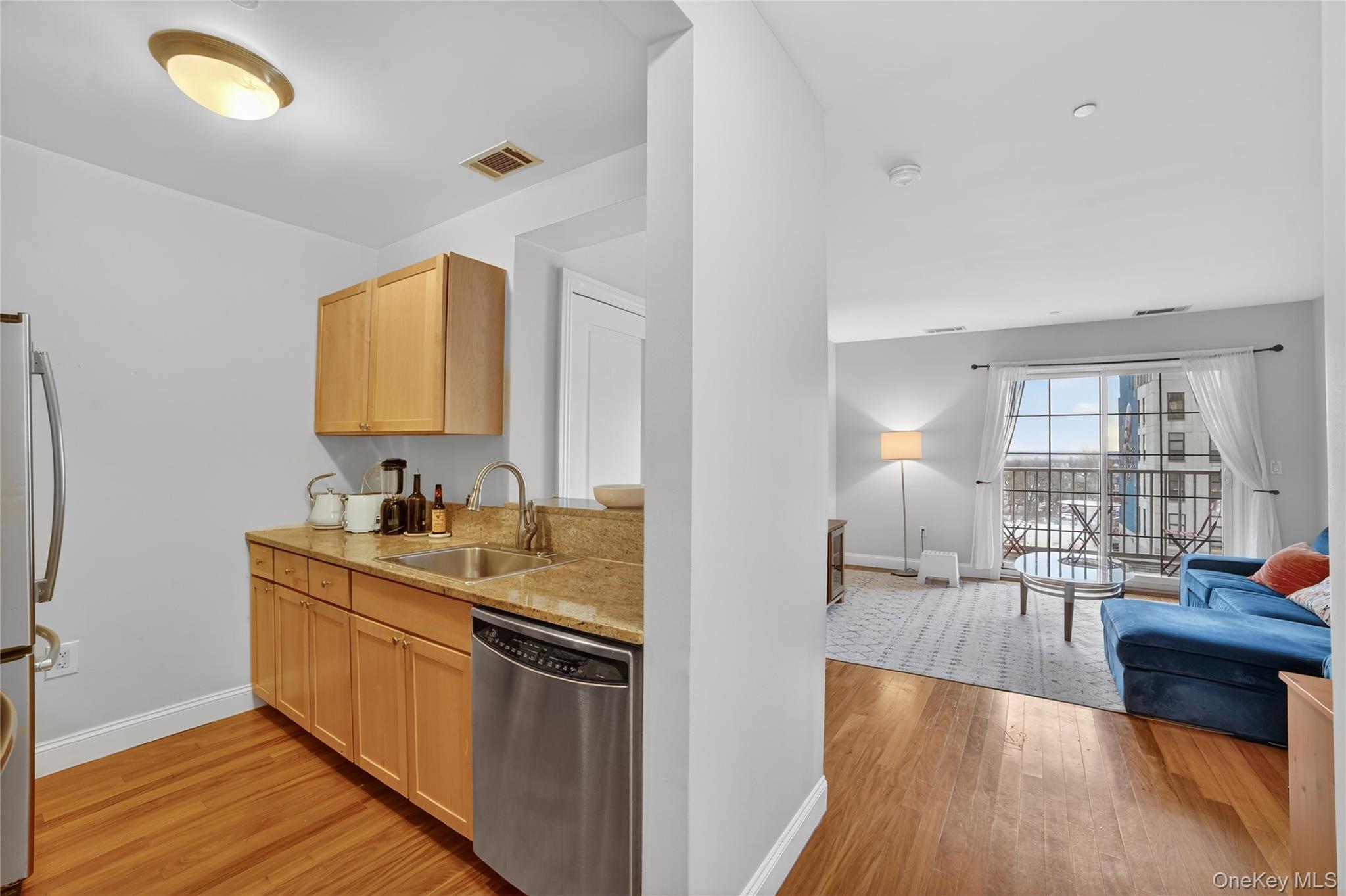 543 Main Street, Unit 502 New Rochelle, NY 10801 - Photo 9 of 31 The kitchen is open to the living room.