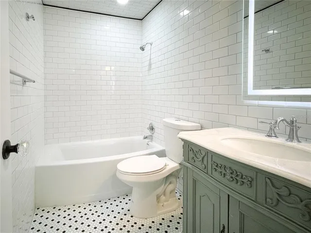 a bathroom with a sink a toilet and a bathtub