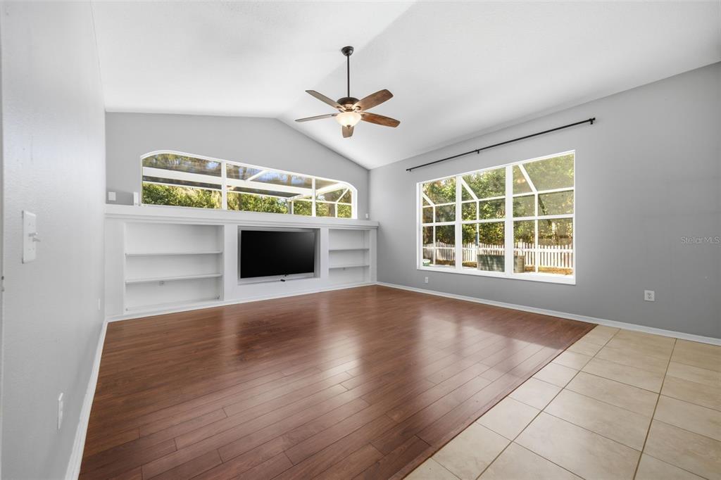 3209 Partridge Point Trail Valrico, FL 33596 - Photo 33 of 66 an empty room with windows and fireplace