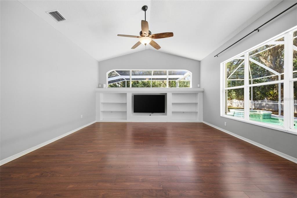 3209 Partridge Point Trail Valrico, FL 33596 - Photo 34 of 66 wooden floor in an empty room with a window