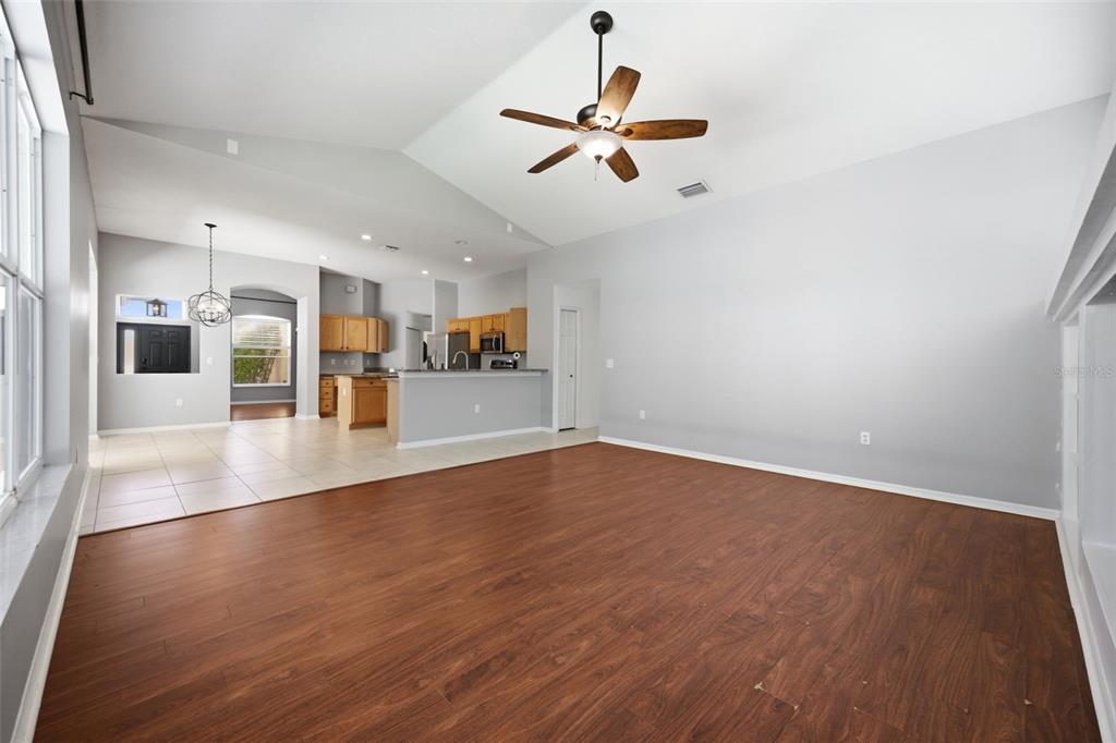 3209 Partridge Point Trail Valrico, FL 33596 - Photo 35 of 66 wooden floor in an empty room with a window