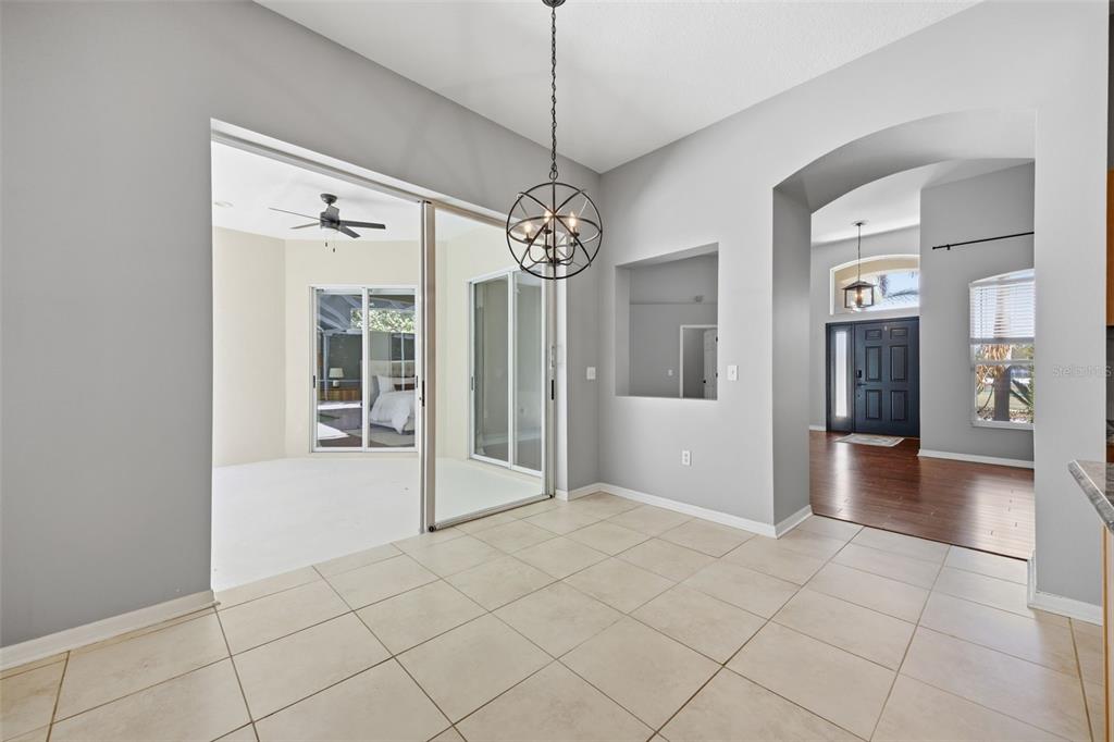 3209 Partridge Point Trail Valrico, FL 33596 - Photo 37 of 66 a view of a hallway with chandelier and living room