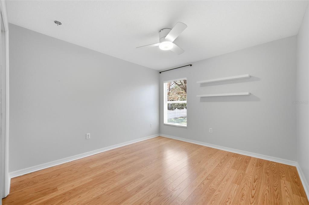 3209 Partridge Point Trail Valrico, FL 33596 - Photo 40 of 66 an empty room with wooden floor and windows