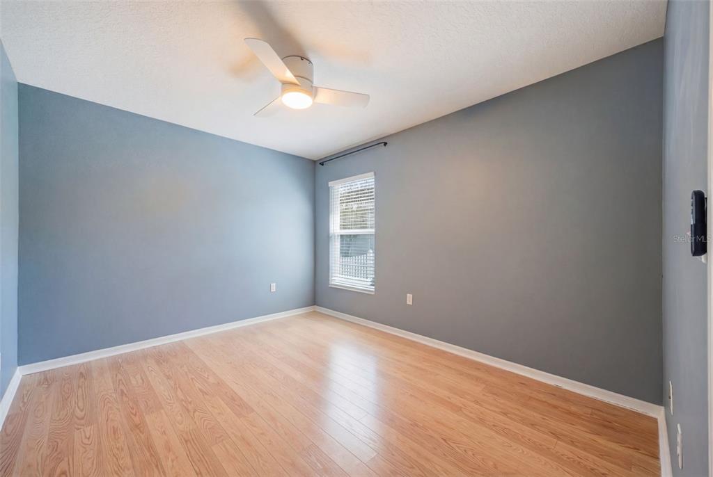 3209 Partridge Point Trail Valrico, FL 33596 - Photo 41 of 66 a view of an empty room with wooden floor and a window