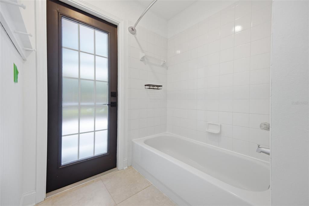 3209 Partridge Point Trail Valrico, FL 33596 - Photo 44 of 66 a bathroom with a bathtub and a shower