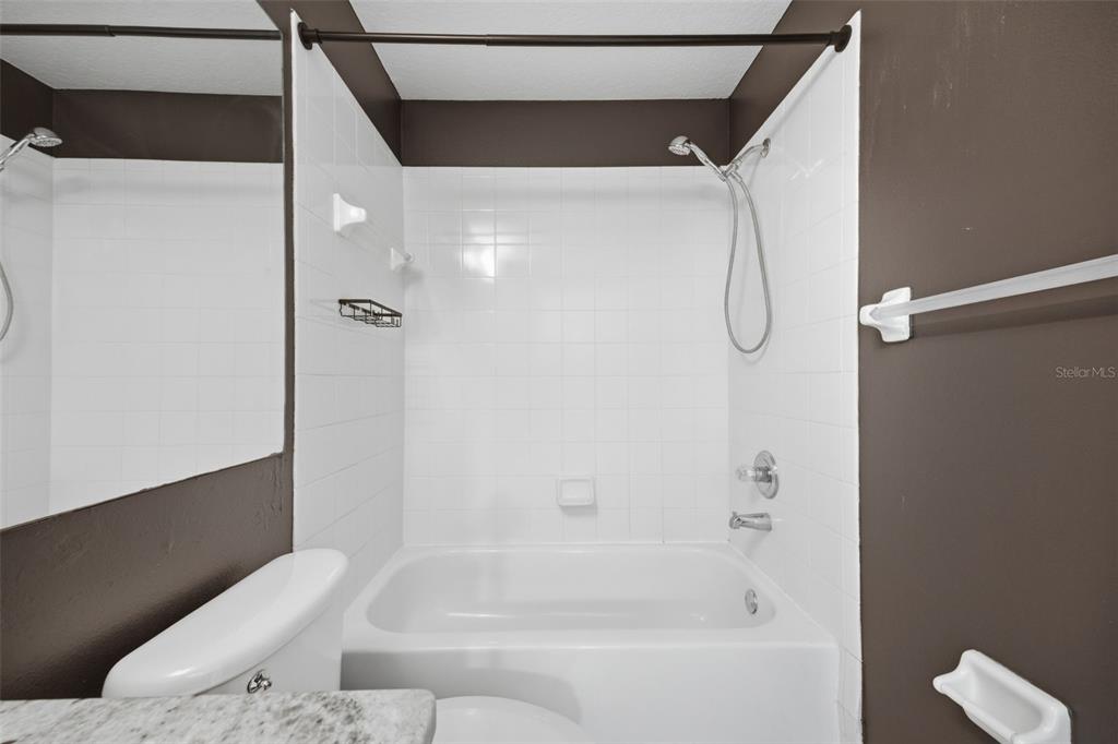 3209 Partridge Point Trail Valrico, FL 33596 - Photo 53 of 66 a bathroom with a bathtub and shower