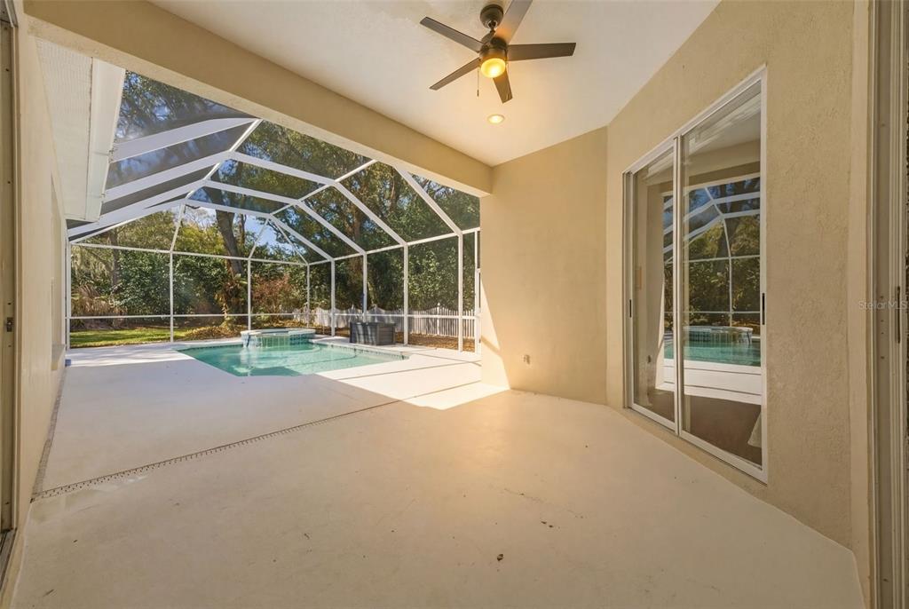 3209 Partridge Point Trail Valrico, FL 33596 - Photo 56 of 66 a view of an empty room with a sliding door