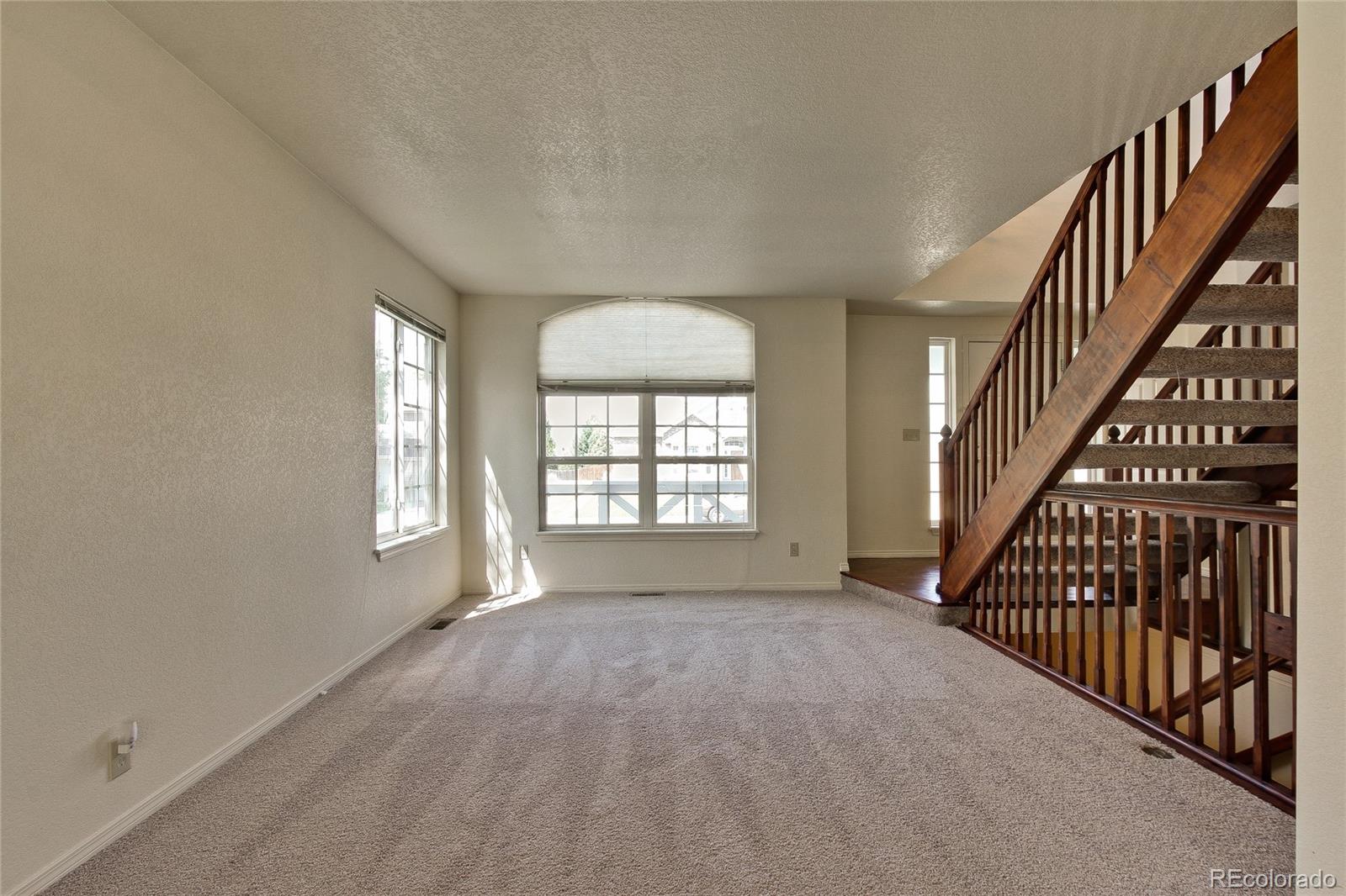504 Rider Ridge Drive Longmont, CO 80504 - Photo 5 of 34 wooden floor in an empty room with a window