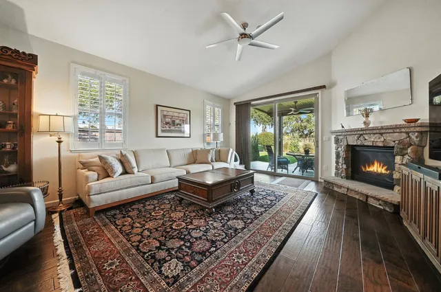 a kitchen with stainless steel appliances granite countertop wooden cabinets a stove a sink and dishwasher next to a window