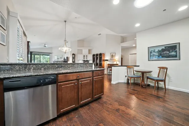 a living room with furniture fireplace and window