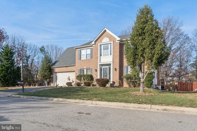 a living room with furniture large window and flat screen tv