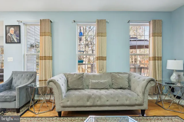 a kitchen with stainless steel appliances granite countertop a refrigerator a stove and a sink