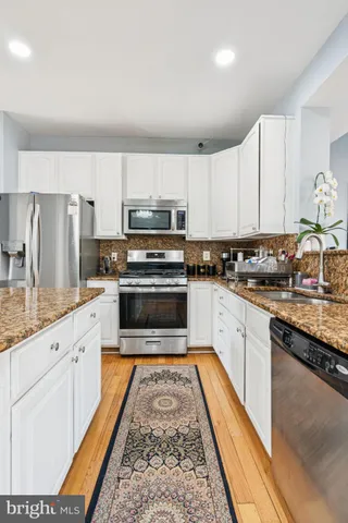 a living room with furniture and a rug