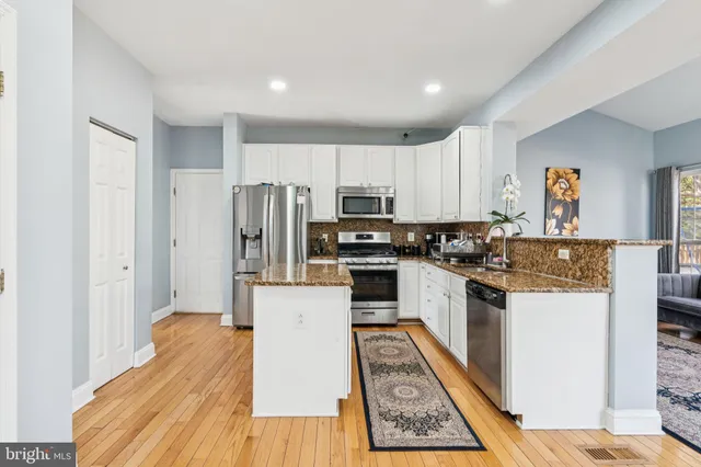 a bathroom with a toilet a sink and shower
