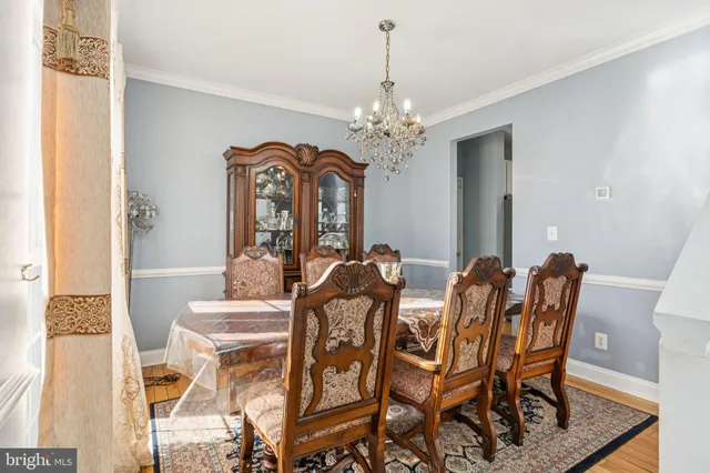 a white toilet sitting next to a window in a bathroom