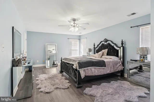 a bedroom with a bed and a cabinets